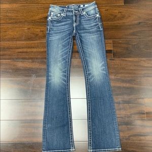 Silver accented medium wash jeans